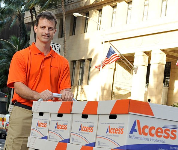 man with boxes of legal documents for transfer